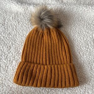 Primark beanie in yellow with faux fur pom Pom